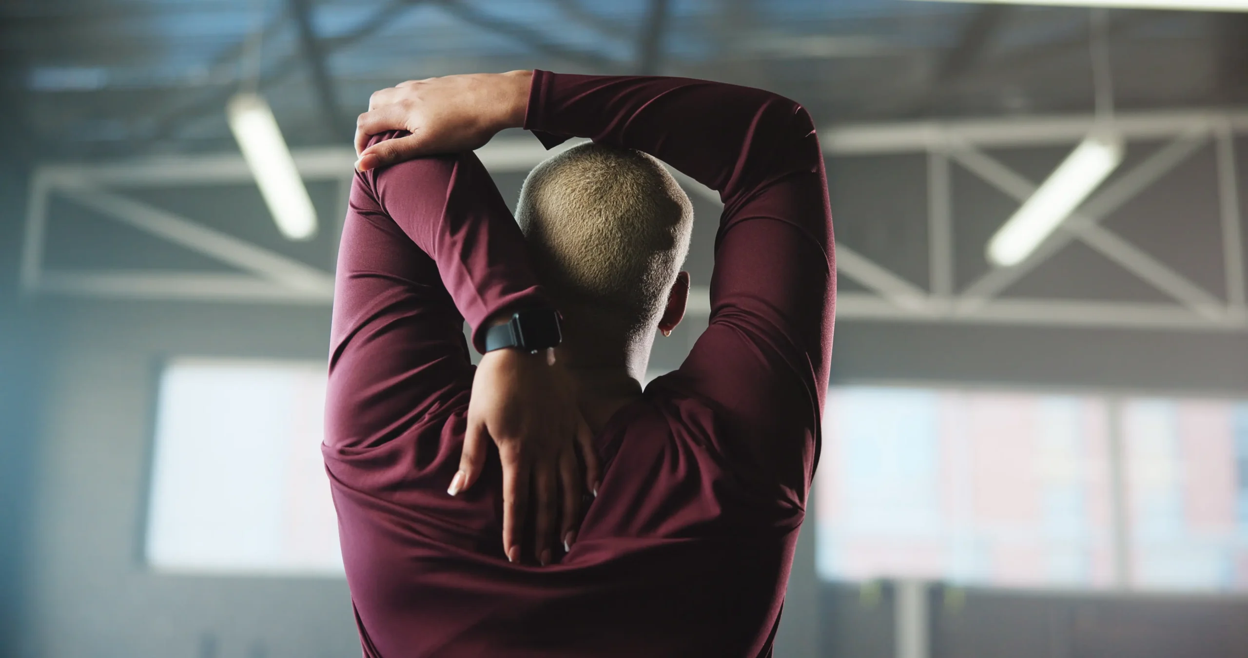 Man stretching to build tolerance after an MRI for back pain diagnosis