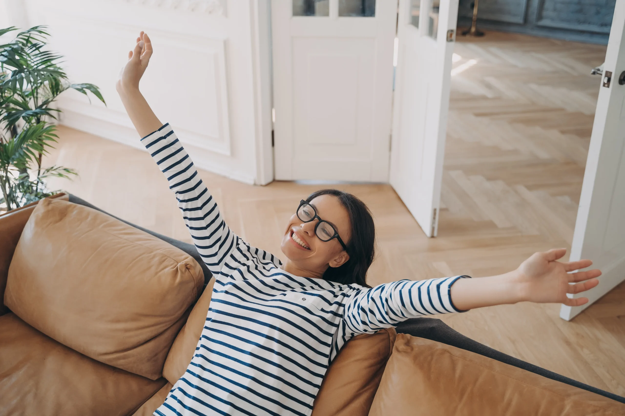 Woman doing a simple back-strengthening exercise at home